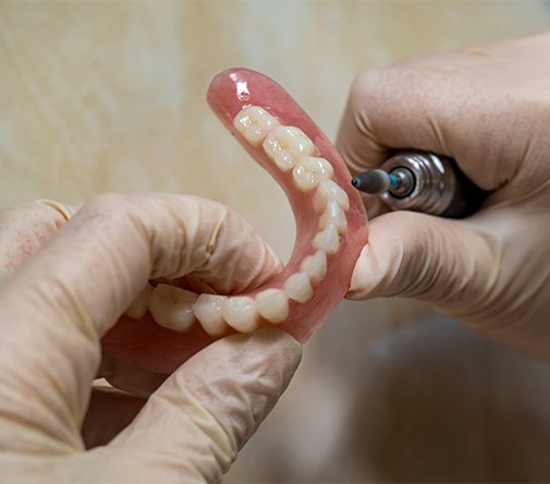 Man filing dentures