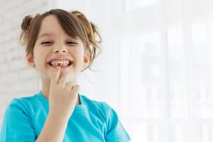 Child with a missing tooth